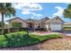 Single-Gathering home with 2-car garage and lush landscaping at 8678 Sw 83Rd Cir, Ocala, FL 34481