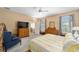 Main bedroom with ensuite bathroom and access to the living area at 8678 Sw 83Rd Cir, Ocala, FL 34481