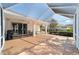 Large screened patio with covered section, ceiling fans and outdoor grill at 8678 Sw 83Rd Cir, Ocala, FL 34481