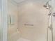 Walk-in shower with built-in seat and neutral-toned tile at 8678 Sw 83Rd Cir, Ocala, FL 34481