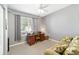 Bright home office with a desk, comfortable couch, and ample natural light at 8678 Sw 83Rd Cir, Ocala, FL 34481