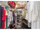 Well-lit walk-in closet with ample shelving and hanging space at 8678 Sw 83Rd Cir, Ocala, FL 34481