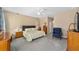 Large main bedroom with carpeted floors, ample closet space, and ensuite bathroom at 8678 Sw 83Rd Cir, Ocala, FL 34481