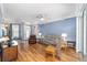 Light and airy living room with hardwood floors and neutral decor at 8678 Sw 83Rd Cir, Ocala, FL 34481