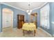 Bright dining room features a table with seating for four and built-in hutch at 8678 Sw 83Rd Cir, Ocala, FL 34481