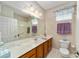 Clean bathroom, featuring a large vanity with marble countertop at 8678 Sw 83Rd Cir, Ocala, FL 34481