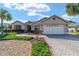Single-Gathering home with 2-car garage and well-manicured landscaping at 8678 Sw 83Rd Cir, Ocala, FL 34481