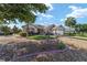 Charming one-story home showcasing a manicured lawn and attractive landscaping at 8678 Sw 83Rd Cir, Ocala, FL 34481