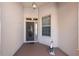 Inviting front porch with decorative door and sidelight at 8678 Sw 83Rd Cir, Ocala, FL 34481