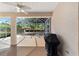 Spacious screened patio with ceiling fan and grill at 8678 Sw 83Rd Cir, Ocala, FL 34481