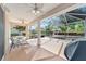 Relaxing screened patio with seating area and grill at 8678 Sw 83Rd Cir, Ocala, FL 34481
