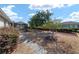 Landscaped backyard with a pebble stone ground cover and walkway at 8678 Sw 83Rd Cir, Ocala, FL 34481