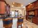 Modern kitchen with dark wood cabinets and granite countertops at 1719 Sw 27Th Pl, Ocala, FL 34471