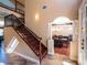 Grand staircase with wrought iron railings and hardwood steps at 1719 Sw 27Th Pl, Ocala, FL 34471