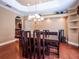 Elegant dining room with hardwood floors and a large chandelier at 1719 Sw 27Th Pl, Ocala, FL 34471