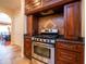Kitchen with stainless steel appliances and dark wood cabinets at 1719 Sw 27Th Pl, Ocala, FL 34471