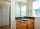 Bathroom with granite countertop and wood cabinets at 1719 Sw 27Th Pl, Ocala, FL 34471