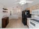 Bright kitchen with white appliances and light wood cabinets at 9145 Sw 90Th St, Ocala, FL 34481