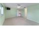 Bedroom with light green walls, carpet, and access to other rooms at 9145 Sw 90Th St, Ocala, FL 34481