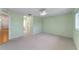 Light green walls and carpeted floors in this serene bedroom at 9145 Sw 90Th St, Ocala, FL 34481