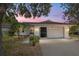 Single story home with white brick exterior and two car garage at 9145 Sw 90Th St, Ocala, FL 34481
