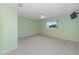 Light green walls and carpeted floors in this tranquil bedroom at 9145 Sw 90Th St, Ocala, FL 34481