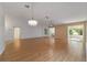 Living room featuring hardwood floors, high ceilings, and a ceiling fan at 9145 Sw 90Th St, Ocala, FL 34481