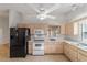 Bright kitchen with light wood cabinets and black appliances at 9145 Sw 90Th St, Ocala, FL 34481