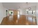 Open living room with hardwood floors and access to a sunroom at 9145 Sw 90Th St, Ocala, FL 34481