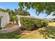 Landscaped backyard with lush greenery and a brick patio at 9145 Sw 90Th St, Ocala, FL 34481