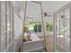 Sunroom with daybed, ceiling fan and view of backyard at 9145 Sw 90Th St, Ocala, FL 34481