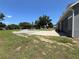 Large lot with gravel driveway, partially paved patio, and new home at 274 Se 34Th Pl, Ocala, FL 34471