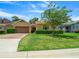 Tan house with brown garage door and green lawn at 3396 Nw 55Th Ct, Ocala, FL 34482