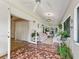 Relaxing sunroom with tiled floors and plenty of natural light at 1923 Se 7Th St, Ocala, FL 34471