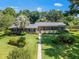 Ranch house with landscaped yard and walkway at 1923 Se 7Th St, Ocala, FL 34471