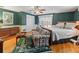 Spacious bedroom with hardwood floors and a king-size bed at 1923 Se 7Th St, Ocala, FL 34471