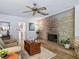 Living room features a stone fireplace and hardwood floors at 1923 Se 7Th St, Ocala, FL 34471