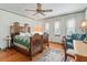 Bedroom with antique wooden bed and hardwood floors at 1923 Se 7Th St, Ocala, FL 34471