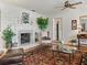 Bright living room with fireplace and hardwood floors at 1923 Se 7Th St, Ocala, FL 34471