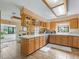 Spacious kitchen with light wood cabinets, tile floors, and island at 1923 Se 7Th St, Ocala, FL 34471
