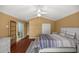Spacious bedroom with hardwood floors and French doors leading to a patio at 2811 Se 14Th St, Ocala, FL 34471