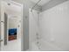Bathroom with shower/tub combo and view of bedroom at 2811 Se 14Th St, Ocala, FL 34471