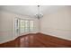 Sunlit dining room showcasing hardwood floors and a bay window at 2811 Se 14Th St, Ocala, FL 34471