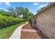 Concrete walkway with landscaping leading to home entrance at 2811 Se 14Th St, Ocala, FL 34471