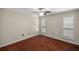 Bright bedroom with hardwood floors and plantation shutters at 2811 Se 14Th St, Ocala, FL 34471