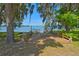 Wooden deck overlooking the lake with picnic tables at 25235 Ne 142Nd Ne Ln # Lot 185, Salt Springs, FL 32134