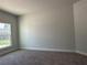 Bright bedroom with carpeted floor and large window at 11600 Sw 55Th Ave, Ocala, FL 34476