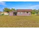 Back of the house with a large yard at 46 Lake Court Loop, Ocala, FL 34472