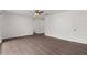 Living room featuring wood-look floors and wainscoting at 46 Lake Court Loop, Ocala, FL 34472