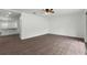 Bright living room with hardwood floors and access to kitchen at 46 Lake Court Loop, Ocala, FL 34472